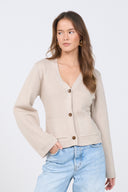 Beige knit cardigan with V-neck and buttons – women’s minimalist sweater.
